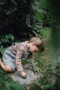 girl playing on ground