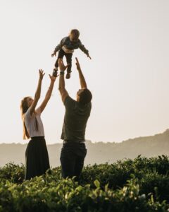 parents child in air